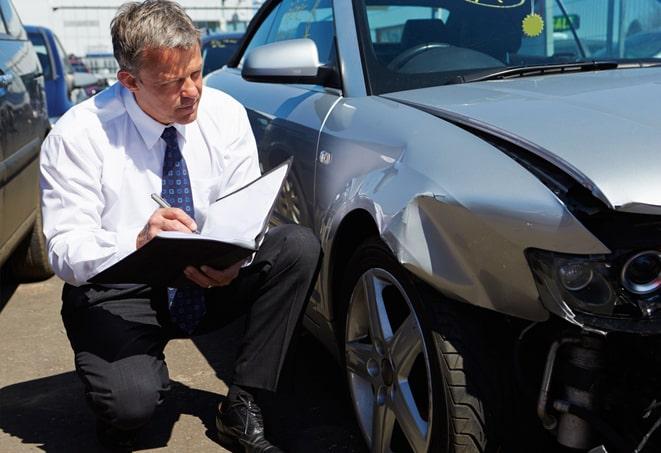 car insurance accident report form on desk